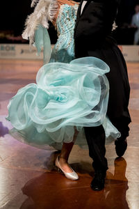 Low section of people walking on street