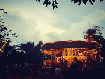 Low angle view of illuminated ferris wheel