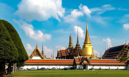 View of temple building against cloudy sky