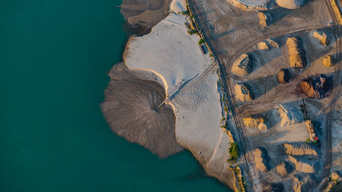 High angle view of rocks by sea