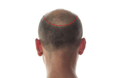 Close-up portrait of man against white background