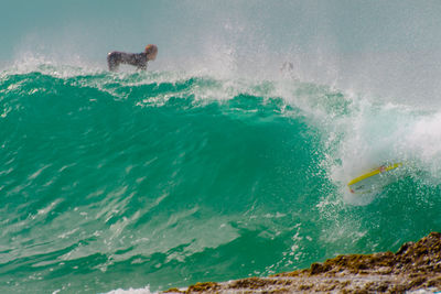 People surfing in sea