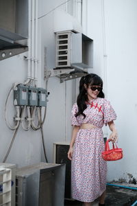 Portrait of woman in pink modern cheongsam