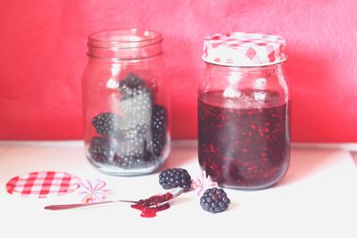 Close-up of drink in glass jar on table