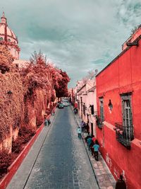 Street amidst buildings against sky