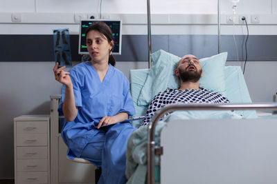 Young couple sitting on bed