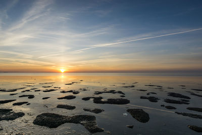 Scenic view of sea against sky during sunset