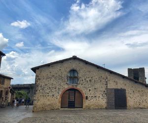 View of old building against cloudy sky