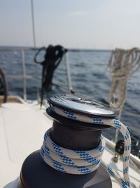 Close-up of food on table at beach against sky