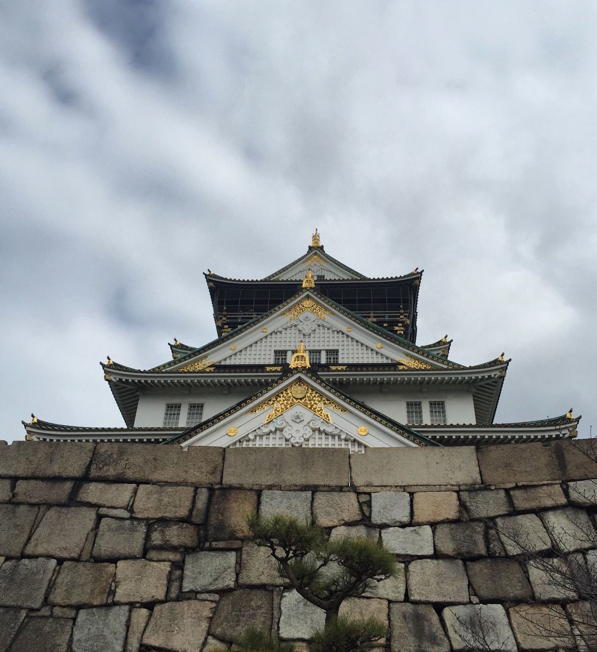 architecture, built structure, building exterior, sky, cloud - sky, place of worship, religion, cloudy, low angle view, spirituality, history, cloud, outdoors, day, famous place, facade, travel destinations, temple - building, architectural feature