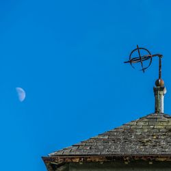 Low angle view of built structure against blue sky