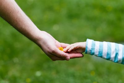 Close-up of couple holding hands