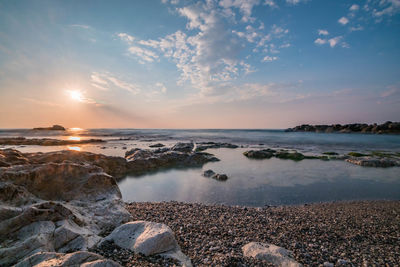 Scenic view of sea against sky during sunset