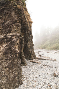 Rock formation on mountain against sky