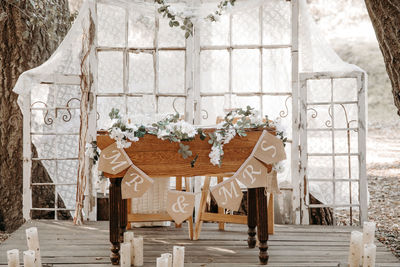 Chairs and table against window of building