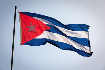 Low angle view of flag against clear sky