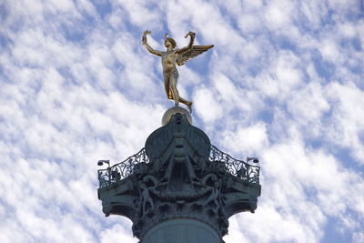 Low angle view of statue against sky