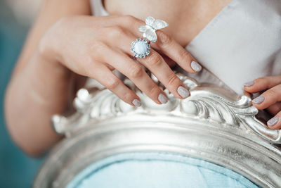 Close-up of woman holding hands