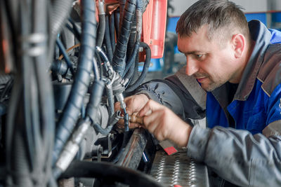 Close-up of man working in factory