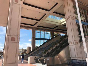 Low angle view of building seen through glass window