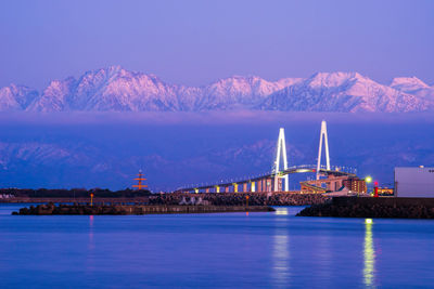 Bridge over sea against sky