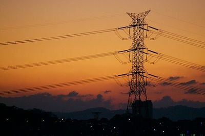 Electricity pylon at sunset