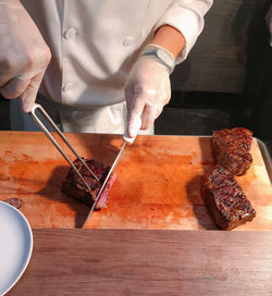 Midsection of man preparing food