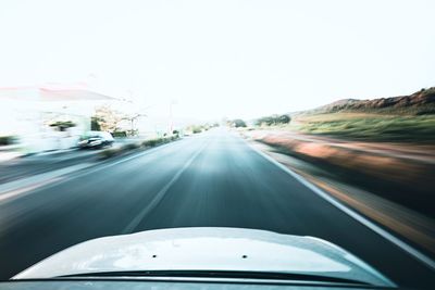 Road seen through car windshield