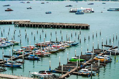 High angle view of boats moored at harbor