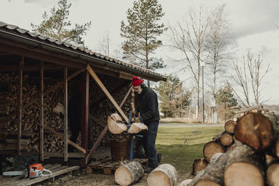 Senior man chopping wood