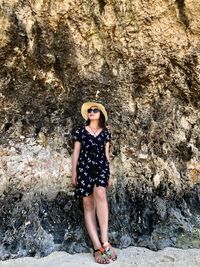 Portrait of woman standing on rock