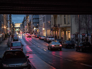 Cars on road in city at night