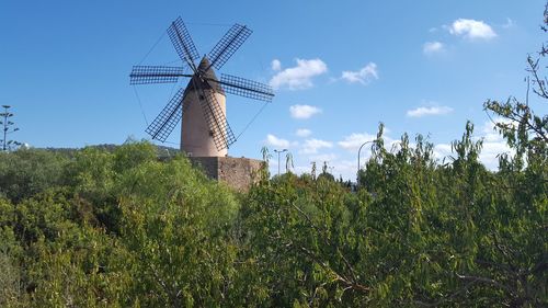 Traditional windmill against sky