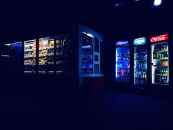 View of illuminated store at night