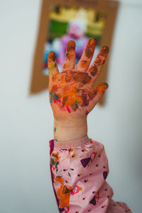 Cropped hand of woman holding figurine