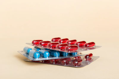 Close-up of pills over white background