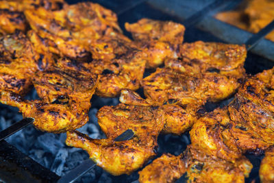 Cooking chicken skew kebab barbeque. indian and pakistani dish cooked on charcoal and flame.
