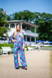 Full length of young woman standing outdoors