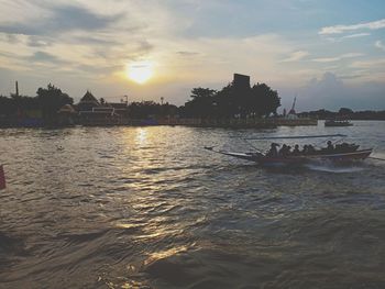 Scenic view of river against sky during sunset