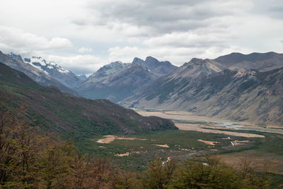 Scenic view of valley mountains against sky in autumn