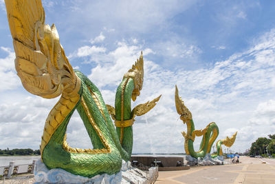 Statue of cactus against sky