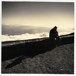 People sitting on rock