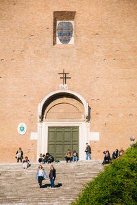 People walking in front of church