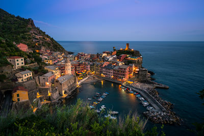 High angle view of sea and buildings against sky