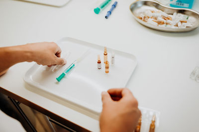 Close-up of hand holding cigarette