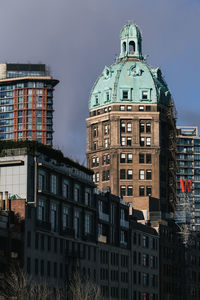 View of buildings in city against sky