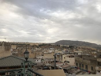 High angle view of buildings in city against sky