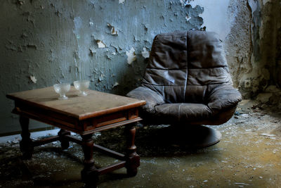 Table and chairs against wall at home