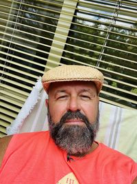 Close-up portrait of man wearing hat