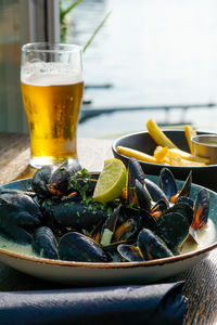 Close up of seafood and drink on table at restaurant